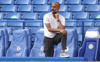 LONDON, ENGLAND - JUNE 25: Pep Guardiola, Manager of Manchester City looks on prior to the Premier League match between Chelsea FC and Manchester City at Stamford Bridge on June 25, 2020 in London, United Kingdom. (Photo by Paul Childs/Pool via Getty Images)