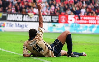 LONDON, ENGLAND - APRIL 1: Thierry Henry celebrates scoring a goal for Arsenal during the Premier League match between Charlton Athletic and Arsenal on April 1, 2002 in London, England. (Photo by Stuart MacFarlane/Arsenal FC via Getty Images)