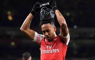 epa07437772 Arsenal's Pierre-Emerick Aubameyang wears a mask as he celebrates scoring the 3-0 goal during  the UEFA Europa League soccer match between Arsenal and Stade Rennes at the Emirates Stadium in London, Britain, 14 March 2019.  EPA/NEIL HALL