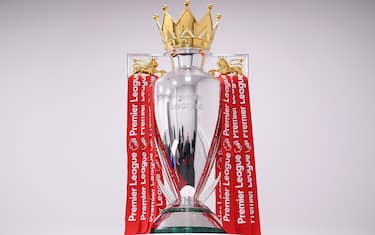 LIVERPOOL, ENGLAND - JULY 22: The Premier League Trophy is dressed in Liverpool Red Ribbons ready for the presentation ceremony ahead of the Premier League match between Liverpool FC and Chelsea FC at Anfield on July 22, 2020 in Liverpool, England. Football Stadiums around Europe remain empty due to the Coronavirus Pandemic as Government social distancing laws prohibit fans inside venues resulting in games being played behind closed doors. (Photo by Laurence Griffiths/Getty Images)