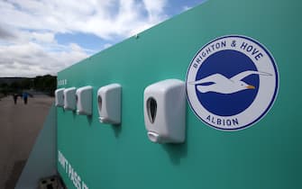 1269497082 BRIGHTON, ENGLAND - AUGUST 29: Anti bacterial stations are seen outside the stadium during the pre-season friendly between Brighton & Hove Albion and Chelsea at Amex Stadium on August 29, 2020 in Brighton, England. (Photo by Steve Bardens/Getty Images)