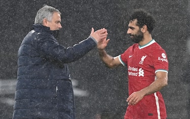 epa08972081 Tottenham manager Jose Mourinho (L) shakes hands with Liverpool's Mohamed Salah (R) after the English Premier League soccer match between Tottenham Hotspur and Liverpool FC in London, Britain, 28 January 2021.  EPA/Shaun Botterill / POOL EDITORIAL USE ONLY. No use with unauthorized audio, video, data, fixture lists, club/league logos or 'live' services. Online in-match use limited to 120 images, no video emulation. No use in betting, games or single club/league/player publications.