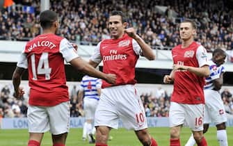 epa03166517 Arsenal's Theo Walcott (L) celebrates with teammates Robin Van Persie and Aaron Ramsey after scoring for Arsenal against QPR during an English Premier League soccer match at Loftus Road in London, Britain, 31 March 2012.
DataCo terms and conditions apply. http//www.epa.eu/downloads/DataCo-TCs.pdf  EPA/ANDY RAIN Special Instructions  DataCo terms and conditions apply. http//www.epa.eu/downloads/DataCo-TCs.pdf