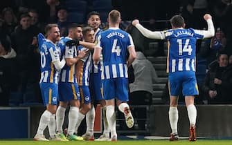 Brighton and Hove Albion's Leandro Trossard (third left) celebrates with team-mates after scoring his side's first goal during the Premier League match at the AMEX Stadium, Brighton. Picture date: Sunday December 26, 2021.