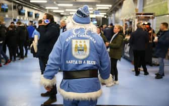 MANCHESTER, ENGLAND - DECEMBER 14: A fan is seen dressed as Santa Clause inside the stadium prior to the Premier League match between Manchester City and Leeds United at Etihad Stadium on December 14, 2021 in Manchester, England. (Photo by Alex Livesey/Getty Images)