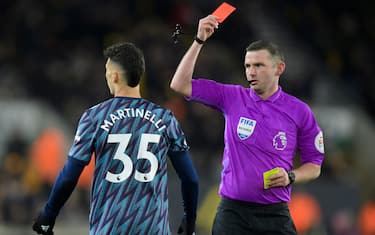 Referee Michael Oliver (right) shows the red card to Gabriel Martinelli of Arsenal during the Premier League match at Molineux, Wolverhampton
Picture by Russell Hart/Focus Images/Sipa USA 
10/02/2022