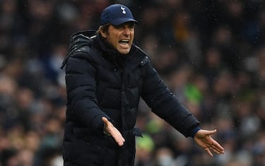 Tottenham Hotspur's Italian head coach Antonio Conte gestures on the touchline during the English Premier League football match between Tottenham Hotspur and Wolverhampton Wanderers at Tottenham Hotspur Stadium in London, on February 13, 2022. - - RESTRICTED TO EDITORIAL USE. No use with unauthorized audio, video, data, fixture lists, club/league logos or 'live' services. Online in-match use limited to 120 images. An additional 40 images may be used in extra time. No video emulation. Social media in-match use limited to 120 images. An additional 40 images may be used in extra time. No use in betting publications, games or single club/league/player publications. (Photo by Daniel LEAL / AFP) / RESTRICTED TO EDITORIAL USE. No use with unauthorized audio, video, data, fixture lists, club/league logos or 'live' services. Online in-match use limited to 120 images. An additional 40 images may be used in extra time. No video emulation. Social media in-match use limited to 120 images. An additional 40 images may be used in extra time. No use in betting publications, games or single club/league/player publications. / RESTRICTED TO EDITORIAL USE. No use with unauthorized audio, video, data, fixture lists, club/league logos or 'live' services. Online in-match use limited to 120 images. An additional 40 images may be used in extra time. No video emulation. Social media in-match use limited to 120 images. An additional 40 images may be used in extra time. No use in betting publications, games or single club/league/player publications. (Photo by DANIEL LEAL/AFP via Getty Images)
