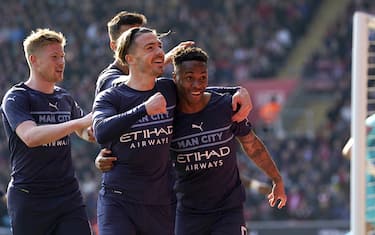 Manchester City's Raheem Sterling (right) celebrates scoring their side's first goal of the game during the Emirates FA Cup quarter final match at St Mary's Stadium, Southampton. Picture date: Sunday March 20, 2022.