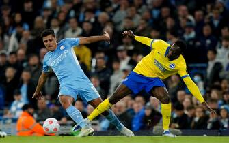 Manchester City's Rodri battles with Brighton and Hove Albion's Danny Welbeck during the Premier League match at the Etihad Stadium, Manchester. Picture date: Wednesday April 20, 2022.