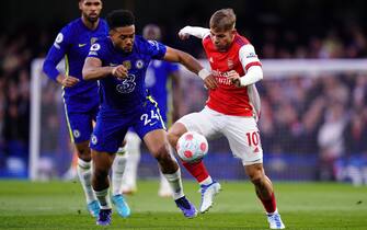 Chelsea's Reece James and Arsenal's Emile Smith Rowe (right) battle for the ball during the Premier League match at Stamford Bridge, London. Picture date: Wednesday April 20, 2022.