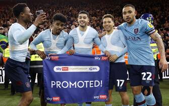 Burnley players celebrate promotion to the Premier League following during the Sky Bet Championship match at the Riverside Stadium, Middlesbrough. Picture date: Friday April 7, 2023.