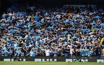 epa10643871 Manchester City's fans do the Poznan sporting celebration during the English Premier League soccer match between Manchester City and Chelsea at the Etihad in Manchester, Britain, 21 May 2023.  EPA/Peter Powell EDITORIAL USE ONLY. No use with unauthorized audio, video, data, fixture lists, club/league logos or 'live' services. Online in-match use limited to 120 images, no video emulation. No use in betting, games or single club/league/player publications