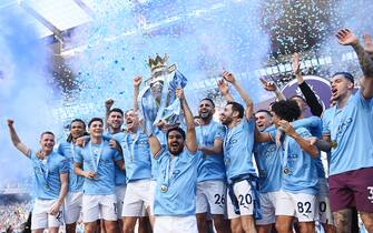 MANCHESTER, ENGLAND - MAY 21: Ilkay Guendogan of Manchester City lifts the Premier League trophy following the Premier League match between Manchester City and Chelsea FC at Etihad Stadium on May 21, 2023 in Manchester, England. (Photo by Michael Regan/Getty Images)