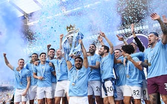 MANCHESTER, ENGLAND - MAY 21: Ilkay Guendogan of Manchester City lifts the Premier League trophy following the Premier League match between Manchester City and Chelsea FC at Etihad Stadium on May 21, 2023 in Manchester, England. (Photo by Michael Regan/Getty Images)