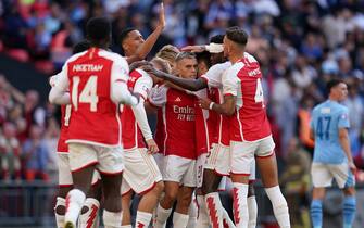 Arsenal's Leandro Trossard (centre) celebrates with team-mates after scoring their side's first goal of the game during the FA Community Shield match at Wembley Stadium, London. Picture date: Sunday August 6, 2023.