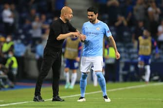PORTO, PORTUGAL - MAY 29: Manchester City manager Pep Guardiola speaks with Ilkay Gundogan during the UEFA Champions League Final between Manchester City and Chelsea FC at Estadio do Dragao on May 29, 2021 in Porto, Portugal. (Photo by Simon Stacpoole/Offside/Offside via Getty Images)