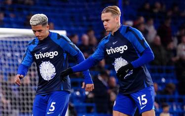 Chelsea's Enzo Fernandez (left) and Mykhailo Mudryk warm up on the pitch ahead of the Premier League match at Stamford Bridge, London. Picture date: Friday February 3, 2023.