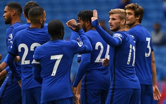 Chelsea's German striker Timo Werner (2nd R) celebrates with teammates after scoring the opening goal of the pre-season friendly football match between Brighton and Hove Albion and Chelsea at the American Express Community Stadium in Brighton, southern England on August 29, 2020. - The game is a 'pilot' event where a small number of fans will be present on a socially-distanced basis. The aim is to get fans back into stadiums in the Premier League by October. (Photo by Glyn KIRK / AFP) (Photo by GLYN KIRK/AFP via Getty Images)