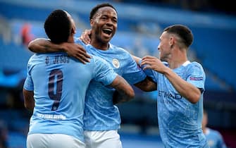 epa08590500 Manchester City's Raheem Sterling (C) celebrates with his teammates after scoring the 1-0 lead during the UEFA Champions League Round of 16 second leg soccer match between Manchester City and Real Madrid in Manchester, Britain, 07 August 2020.  EPA/Dave Thompson / POOL