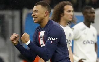 epa10493021 Kylian Mbappe of Paris Saint Germain celebrates scoring the opening goal during the French Ligue 1 soccer match between Olympique Marseille and Paris Saint Germain at the Velodrome Stadium in Marseille, southern France, 26 February 2023.  EPA/SEBASTIEN NOGIER