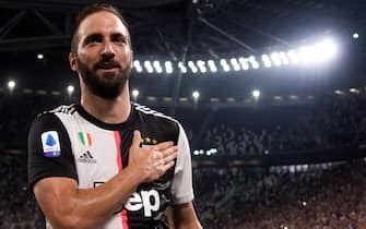 Juventus' Argentinian forward Gonzalo Higuain celebrates after scoring a goal during the Italian Serie A football match Juventus vs Napoli on August 31, 2019 at the Juventus stadium in Turin. (Photo by Marco BERTORELLO / AFP)        (Photo credit should read MARCO BERTORELLO/AFP/Getty Images)
