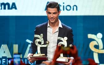 Juventus' Portuguese forward Cristiano Ronaldo receives the award of best player of the year of the Italian championship Serie A during the 'Gran Gala del Calcio' awards ceremony, organised by the Italian Footballers' Association (AIC), on December 2, 2019, in Milan. (Photo by MIGUEL MEDINA / AFP) (Photo by MIGUEL MEDINA/AFP via Getty Images)