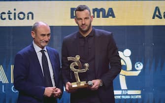 MILAN, ITALY - DECEMBER 02:  Samir Handanovic (R) poses with the best goalkeeper award during the 'Oscar del Calcio AIC' Italian Football Awards on December 2, 2019 in Milan, Italy.  (Photo by Pier Marco Tacca/Getty Images)