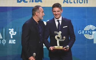 MILAN, ITALY - DECEMBER 02: Antonio Cabrini gives best referee award to Gianluca Rocchi during the 'Oscar del Calcio AIC' Italian Football Awards on December 2, 2019 in Milan, Italy. (Photo by Pier Marco Tacca/Getty Images)