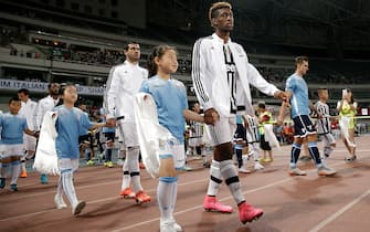 SHANGHAI, CHINA - AUGUST 08:  Kingsley Coman of Juventus FC walks on to the pitch before during Italian Super Cup final football match between Juventus and Lazio at Shanghai Stadium on August 8, 2015 in Shanghai, China.  (Photo by Lintao Zhang/Getty Images)