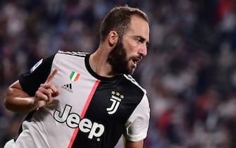 Juventus' Argentinian forward Gonzalo Higuain celebrates after scoring a goal during the Italian Serie A football match Juventus vs Napoli on August 31, 2019 at the Juventus stadium in Turin. (Photo by Marco Bertorello / AFP)        (Photo credit should read MARCO BERTORELLO/AFP via Getty Images)