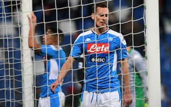 REGGIO NELL'EMILIA, ITALY - DECEMBER 22: Arkadiusz Milik of SSC Napoli  shows his dejection during the Serie A match between US Sassuolo and SSC Napoli at Mapei Stadium - Citta del Tricolore on December 22, 2019 in Reggio nell'Emilia, Italy  (Photo by Alessandro Sabattini/Getty Images)