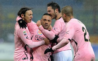 MILAN, ITALY - FEBRUARY 01:  Fabrizio Miccoli (C) of US Citta di Palermo celebrates scoring the third goal during the Serie A match between FC Internazionale Milano and US Citta di Palermo at Stadio Giuseppe Meazza on February 1, 2012 in Milan, Italy.  (Photo by Claudio Villa/Getty Images)