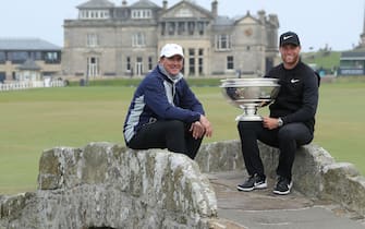 ST ANDREWS, SCOTLAND - OCTOBER 07:  Lucas Bjerregaard of Denmark sits on the Swilcan Bridge with the trophy with his amateur partner Dan Friedkin of the United States after his one shot win in the final round of the 2018 Alfred Dunhill Links Championship on The Old Course at St Andrews on October 7, 2018 in St Andrews, Scotland.  (Photo by David Cannon/Getty Images)