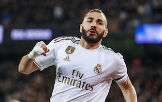 MADRID, SPAIN - NOVEMBER 23: Karim Benzema of Real Madrid celebrates after scoring his team's first goal during the La Liga match between Real Madrid CF and Real Sociedad at Estadio Santiago Bernabeu on November 23, 2019 in Madrid, Spain. (Photo by TF-Images/Getty Images)