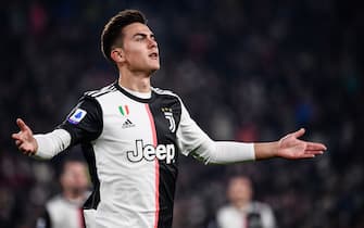 Juventus' Argentine forward Paulo Dybala celebrates after opening the scoring during the Italian Serie A football match Juventus vs AC Milan on November 10, 2019 at the Juventus Allianz stadium in Turin. (Photo by Marco Bertorello / AFP) (Photo by MARCO BERTORELLO/AFP via Getty Images)