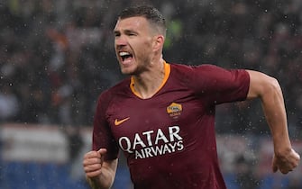 AS Roma Bosnian forward Edin Dzeko celebrates after opening the scoring during the Italian Serie A football match AS Roma vs Udinese on April 13, 2019 at the Olympic stadium in Rome. (Photo by Tiziana FABI / AFP)        (Photo credit should read TIZIANA FABI/AFP via Getty Images)