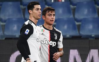 Juventus' Argentine forward Paulo Dybala (C) celebrates with Juventus' Portuguese forward Cristiano Ronaldo after opening the scoring during the Italian Serie A football match Sampdoria vs Juventus on December 18, 2019 at the Luigi-Ferraris stadium in Genoa. (Photo by Marco Bertorello / AFP) (Photo by MARCO BERTORELLO/AFP via Getty Images)