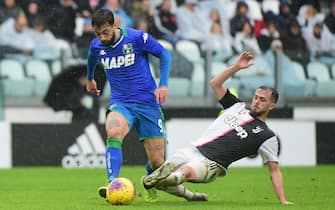 TURIN, ITALY - DECEMBER 01:  (L) Francesco Caputo of US Sassuolo competes for the ball with (R)Miralem Pjanic of Juventus during the Serie A match between Juventus and US Sassuolo at  on December 1, 2019 in Turin, Italy.  (Photo by Pier Marco Tacca Getty Images)