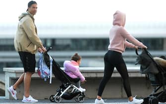 Cristiano Ronaldo (L) and his partner Georgina Rodriguez push two strollers as they have a walk with their children in Funchal on March 28, 2020. (Photo by HELDER SANTOS / AFP) (Photo by HELDER SANTOS/AFP via Getty Images)