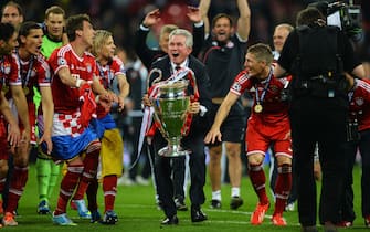 169483531 LONDON, ENGLAND - MAY 25: Head Coach Jupp Heynckes of Bayern Muenchen holds the trophy after winning the UEFA Champions League final match against Borussia Dortmund at Wembley Stadium on May 25, 2013 in London, United Kingdom. (Photo by Laurence Griffiths/Getty Images)