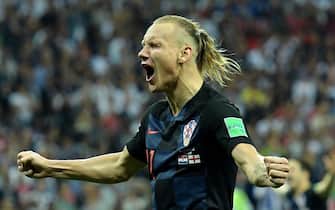 epa06882026 Domagoj Vida of Croatia celebrates winning the FIFA World Cup 2018 semi final soccer match between Croatia and England in Moscow, Russia, 11 July 2018.

(RESTRICTIONS APPLY: Editorial Use Only, not used in association with any commercial entity - Images must not be used in any form of alert service or push service of any kind including via mobile alert services, downloads to mobile devices or MMS messaging - Images must appear as still images and must not emulate match action video footage - No alteration is made to, and no text or image is superimposed over, any published image which: (a) intentionally obscures or removes a sponsor identification image; or (b) adds or overlays the commercial identification of any third party which is not officially associated with the FIFA World Cup)  EPA/PETER POWELL   EDITORIAL USE ONLY