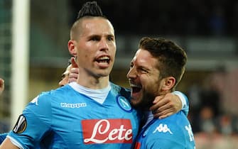 Napoli's midfielder Marek Hamsik, left, jubilates with the teammates Dries Mertens after scoring the 1-0 goal during the UEFA Europa League soccer match between SSC Napoli and Villarreal CF at the San Paolo stadium, Naples, Italy, 25 February 2016. ANSA / CIRO FUSCO