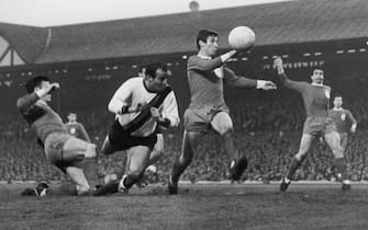 A tense moment for Liverpool players Tommy Smith (left) and Geoff Strong (second from right) as Inter-Milan player Mario Corso lunges in with a header during an attack by the Italian side in a semi-final, first leg match at Anfield, 5th May 1965. Liverpool won the match 3-1. (Photo by Central Press/Hulton Archive/Getty Images)