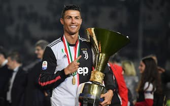 TURIN, ITALY - MAY 19: Cristiano Ronaldo of Juventus celebrates during the awards ceremony after winning the Serie A Championship during the Serie A match between Juventus and Atalanta BC on May 19, 2019 in Turin, Italy. (Photo by Tullio M. Puglia/Getty Images)