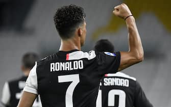 TURIN, ITALY - JULY 20: Cristiano Ronaldo of Juventus FC celebrates after scoring the second goal of his team  during the Serie A match between Juventus and  SS Lazio at  on July 20, 2020 in Turin, Italy. (Photo by Stefano Guidi/Getty Images)