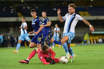 VERONA, ITALY - JULY 26:  The goalkeeper of Hellas Verona, Boris Radunovic fouls to Ciro Immobile of SS Lazio during the Serie A match between Hellas Verona and  SS Lazio at Stadio Marcantonio Bentegodi on July 26, 2020 in Verona, Italy.  (Photo by Pier Marco Tacca/Getty Images)