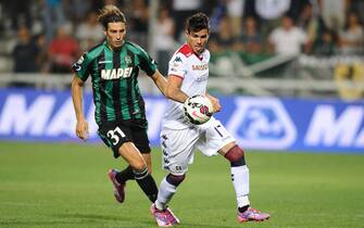 Sassuolo - Cagliari Foto LaPresse - Alessandro Fiocchi
31/08/2014 Reggio Emilia ( Italia)
Sport Calcio
Sassuolo - Cagliari
Campionato di Calcio Serie A TIM 2014 2015 - Stadio "Mapei Stadium"
Nella foto: Peluso/Farias
Photo LaPresse - Alessandro Fiocchi
31 August 2014 Reggio Emilia ( Italy)
Sport Soccer
Sassuolo - Cagliari
Italian Football Championship League A TIM 2014 2015 - "Mapei Stadium"
In the pic: Peluso/Farias
