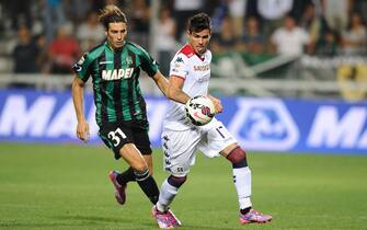 Foto LaPresse - Alessandro Fiocchi
31/08/2014 Reggio Emilia ( Italia)
Sport Calcio
Sassuolo - Cagliari
Campionato di Calcio Serie A TIM 2014 2015 - Stadio "Mapei Stadium"
Nella foto: Peluso/Farias

Photo LaPresse - Alessandro Fiocchi
31 August 2014 Reggio Emilia ( Italy)
Sport Soccer
Sassuolo - Cagliari
Italian Football Championship League A TIM 2014 2015 - "Mapei Stadium"
In the pic: Peluso/Farias