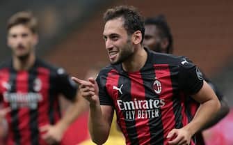 MILAN, ITALY - SEPTEMBER 24:  Hakan Calhanoglu of AC Milan celebrates his second goal during the UEFA Europa League third qualifying round match between AC Milan and Bodo Glimt at Stadio Giuseppe Meazza on September 24, 2020 in Milan, Italy.  (Photo by Emilio Andreoli/Getty Images)