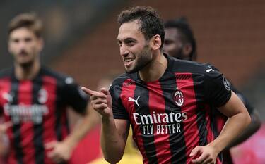 MILAN, ITALY - SEPTEMBER 24:  Hakan Calhanoglu of AC Milan celebrates his second goal during the UEFA Europa League third qualifying round match between AC Milan and Bodo Glimt at Stadio Giuseppe Meazza on September 24, 2020 in Milan, Italy.  (Photo by Emilio Andreoli/Getty Images)
